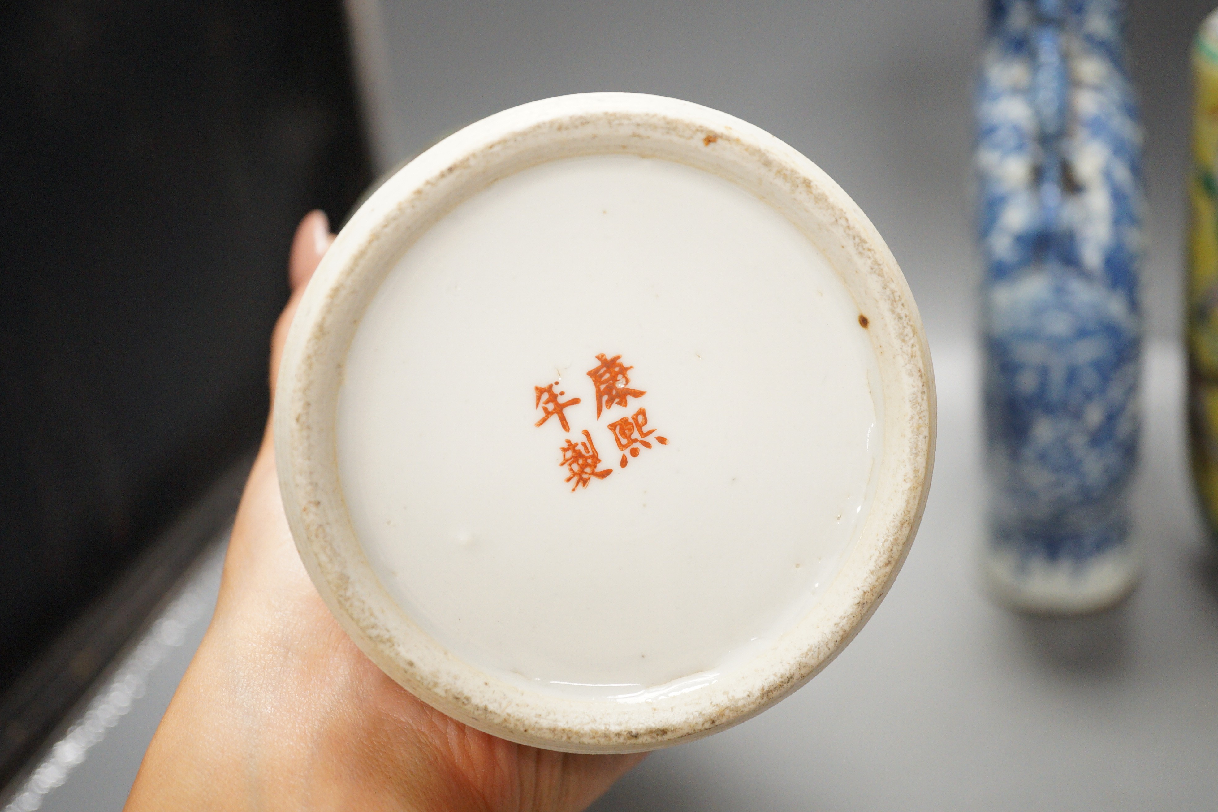 A Chinese famille verte vase and cover, a yellow ground ‘soldiers’ vase, a blue and white moonflask and a similar’dragon’ sleeve vase, all late 19th/early 20th century, Tallest 33cm